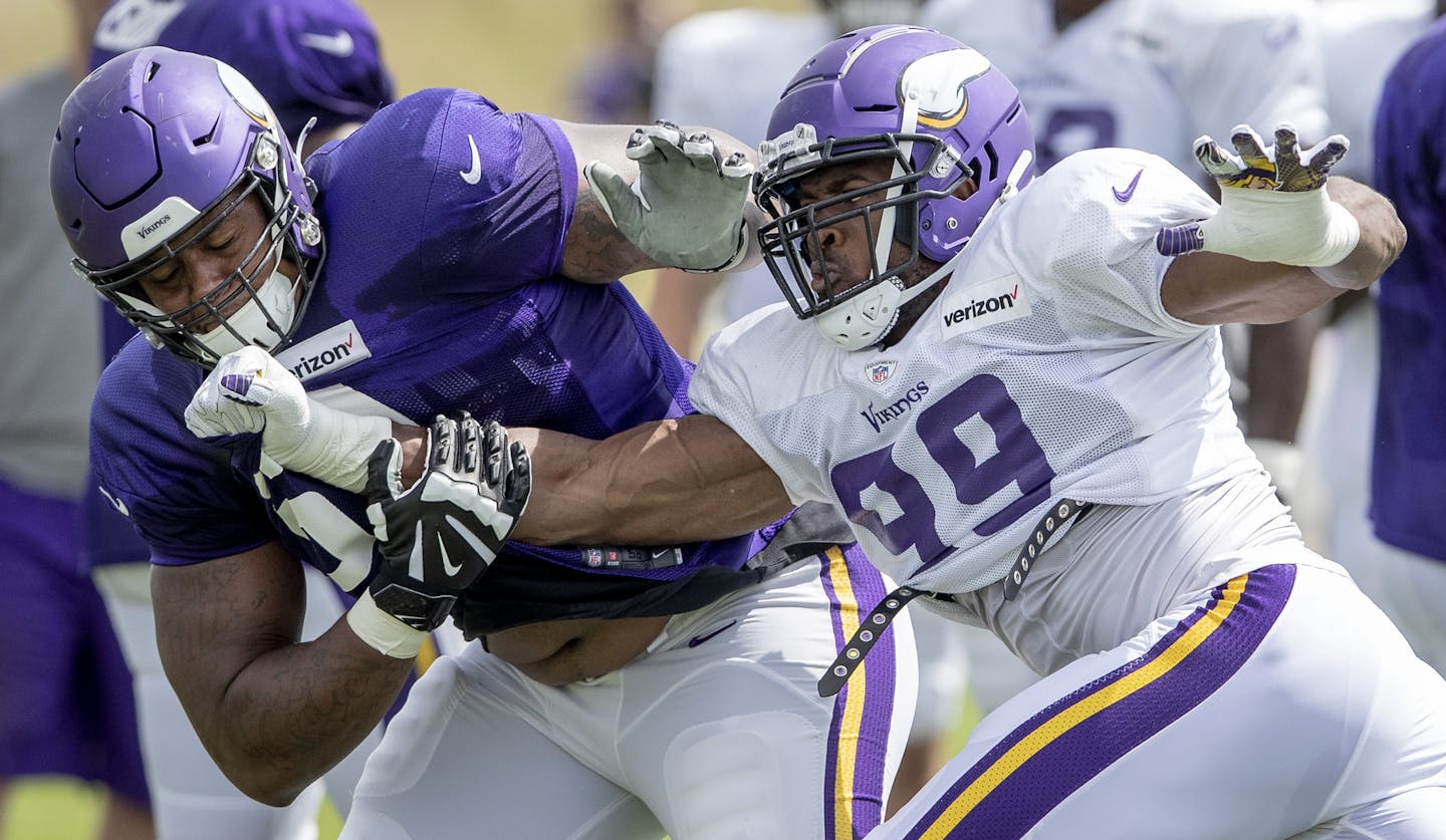 Minnesota Vikings' Rashod Hill (69) and Danielle Hunter (99) faced off during practice. ] CARLOS GONZALEZ • cgonzalez@startribune.com – Eagan, MN – August 15, 2019, TCO Performance Center, NFL, Minnesota Vikings Training Camp,