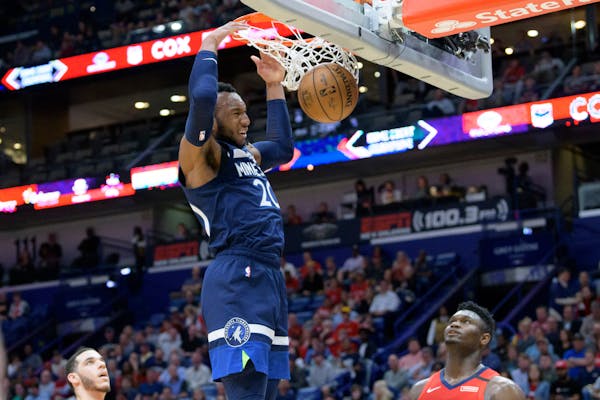 Timberwolves guard Josh Okogie dunks on the Pelicans in the first half