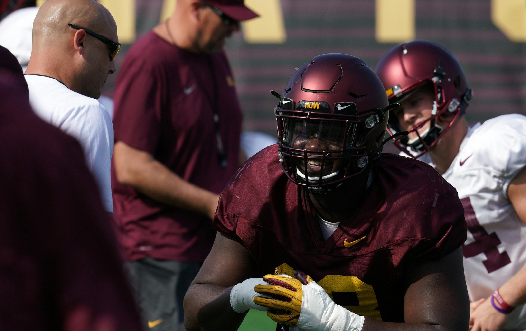 Minnesota Golden Gophers head coach P. J. Fleck talked with defensive tackle Micah Dew-Treadway (18) as he stretched with his teammates during practice Friday. ] ANTHONY SOUFFLE &#x2022; anthony.souffle@startribune.com The Minnesota Golden Gophers football team held an open practice Friday, Aug. 19, 2019 at Athlete's Village on the grounds of the University of Minnesota in Minneapolis.