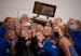 Minnetonka players took their own group selfie after the trophy presentation for their Class 2A championship Wednesday, Oct. 27, 2021 in Minneapolis. 