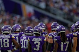 The Vikings offense huddled before a play against Kansas City.