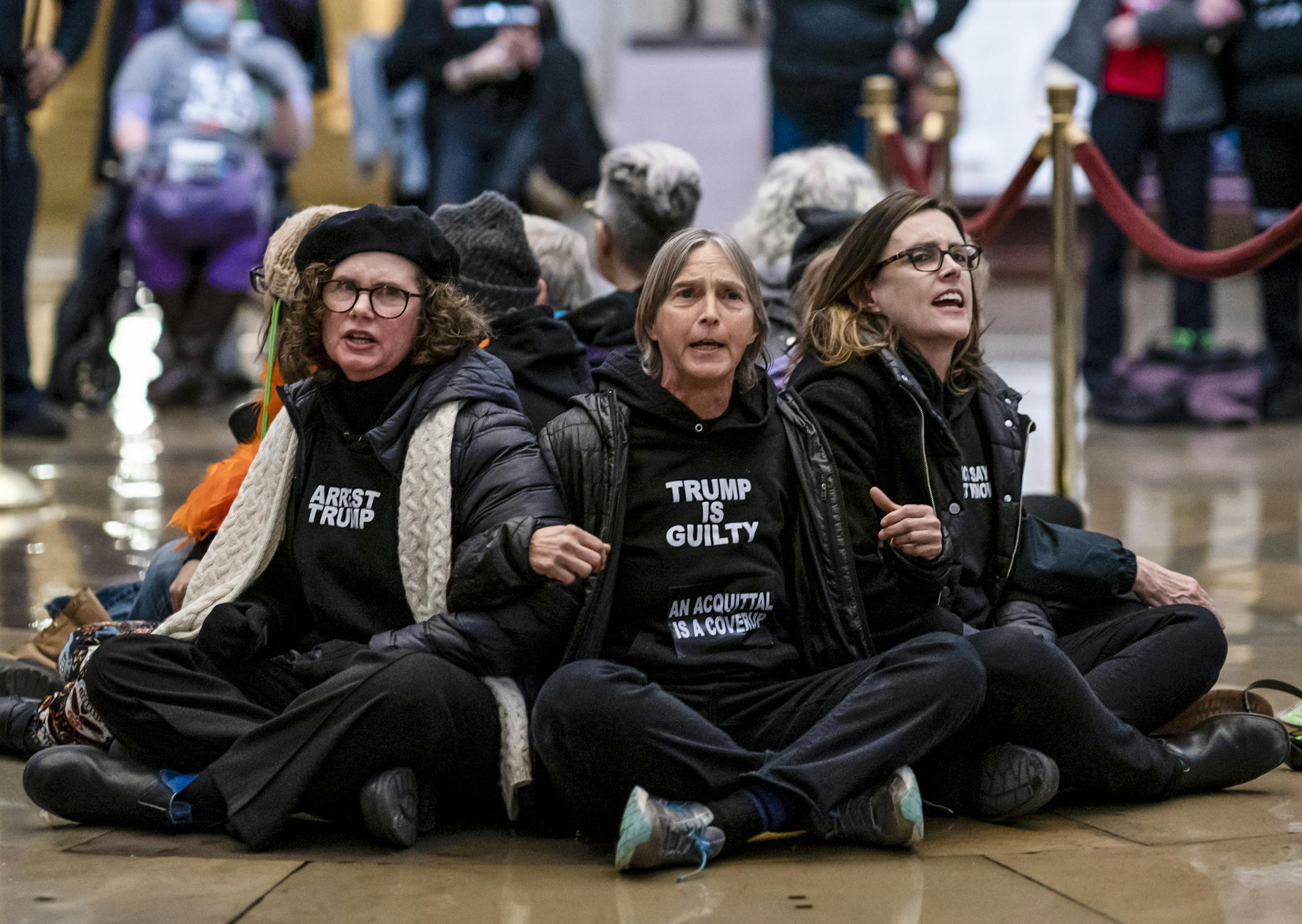 Anti-Trump protestors demonstrate in the Rotunda of the the Capitol in Washington, Wednesday, Feb. 5, 2020, during the impeachment trial of President Donald Trump. (AP Photo/J. Scott Applewhite)