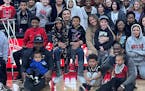 Jalen Suggs drew a crowd right onto his lap Thursday. His mom, Molly Manley, sat at his left, and his dad, Larry Suggs, was on the gym floor near Jale