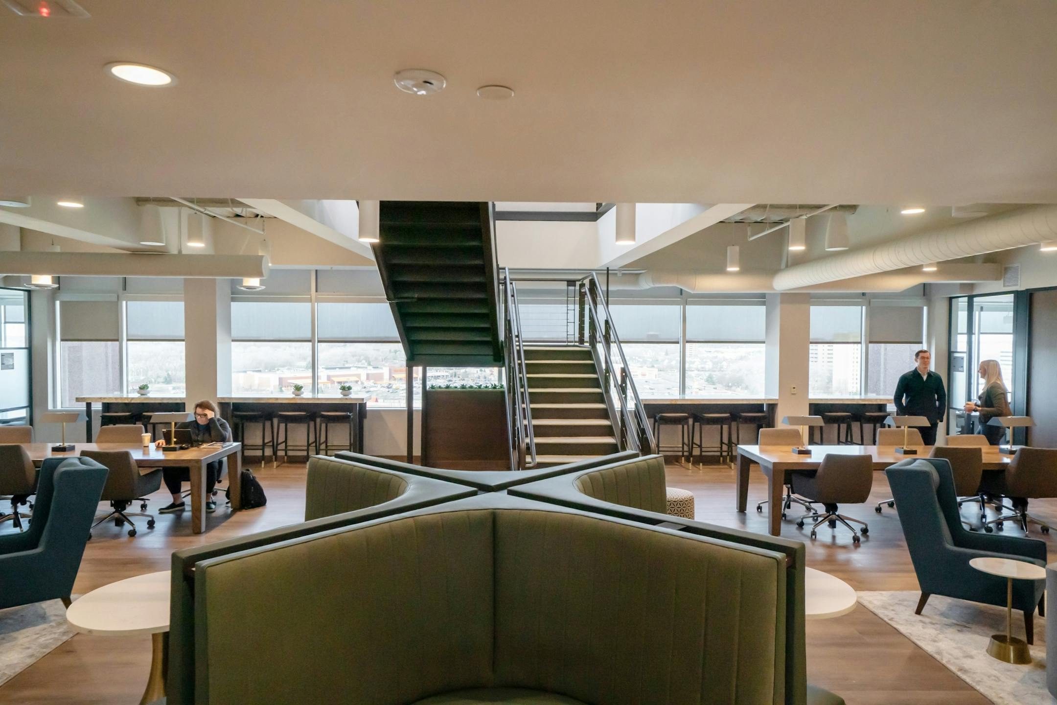 Lounge area with stairs leading to the quiet zone and library.