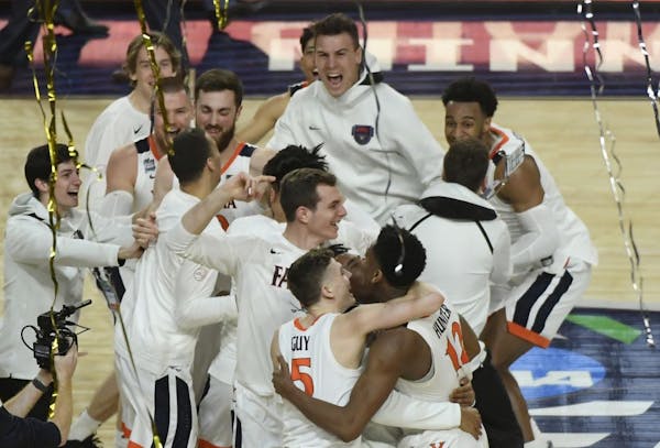 Virginia celebrates its overtime victory over Texas Tech in the NCAA Men's Basketball Championship game Monday night at U.S. Bank Stadium.