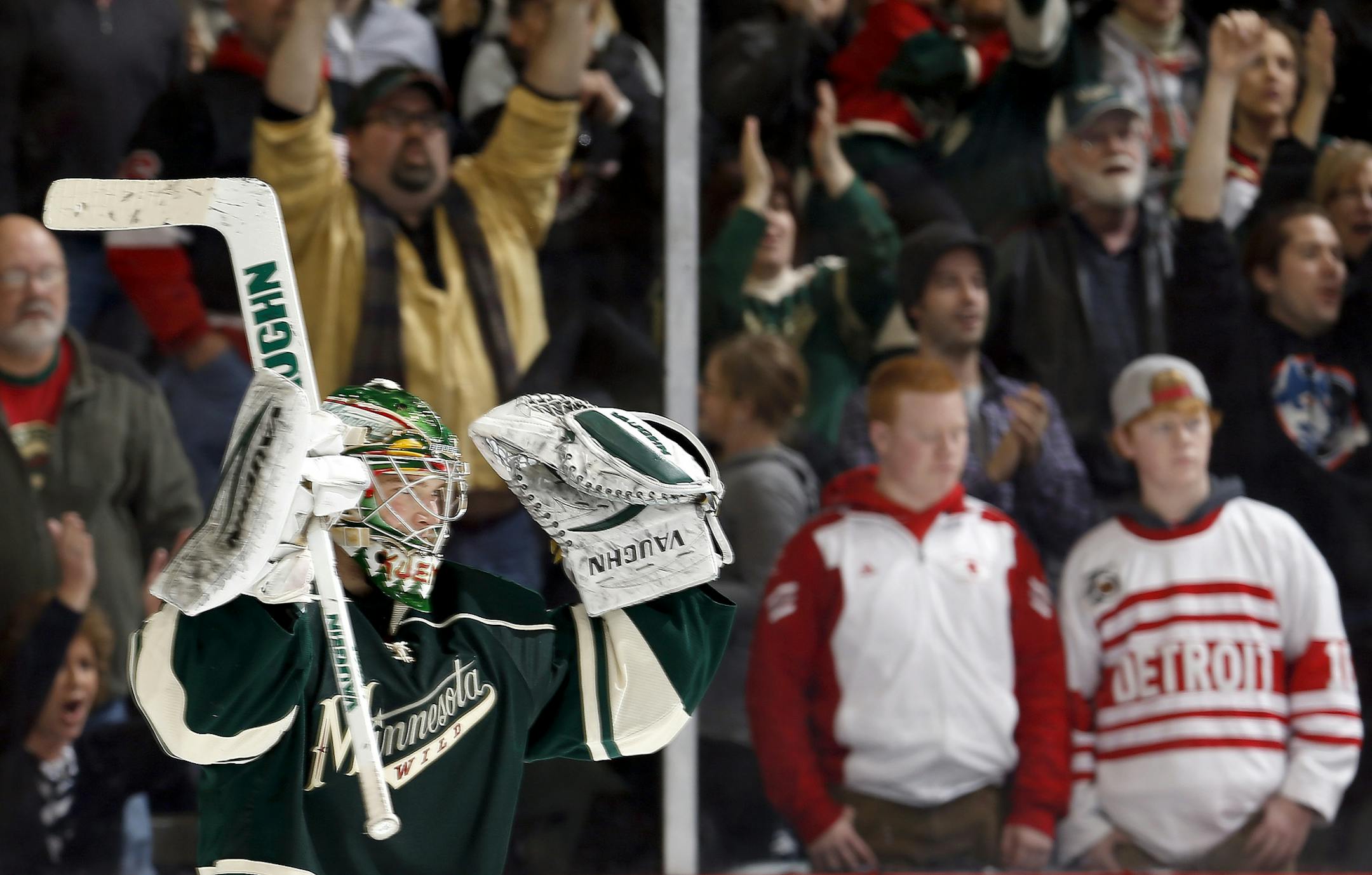 Wild goaltender Darcy Kuemper was pressed into duty at the last minute, but settled down and celebrated at the end of the game when Minnesota hung on to beat Detroit 3-2.