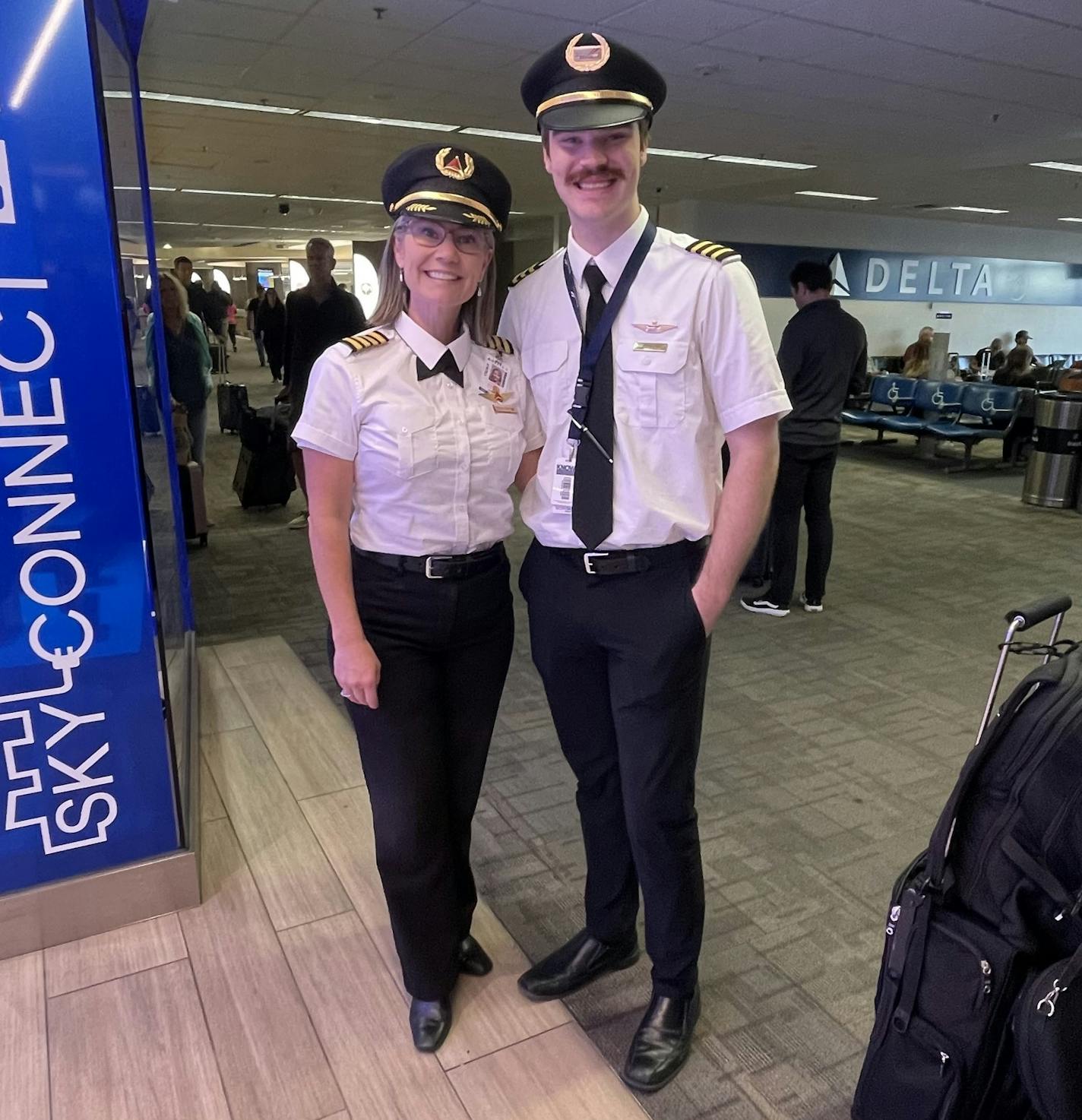 Rohling and her son posing in their pilot uniforms.