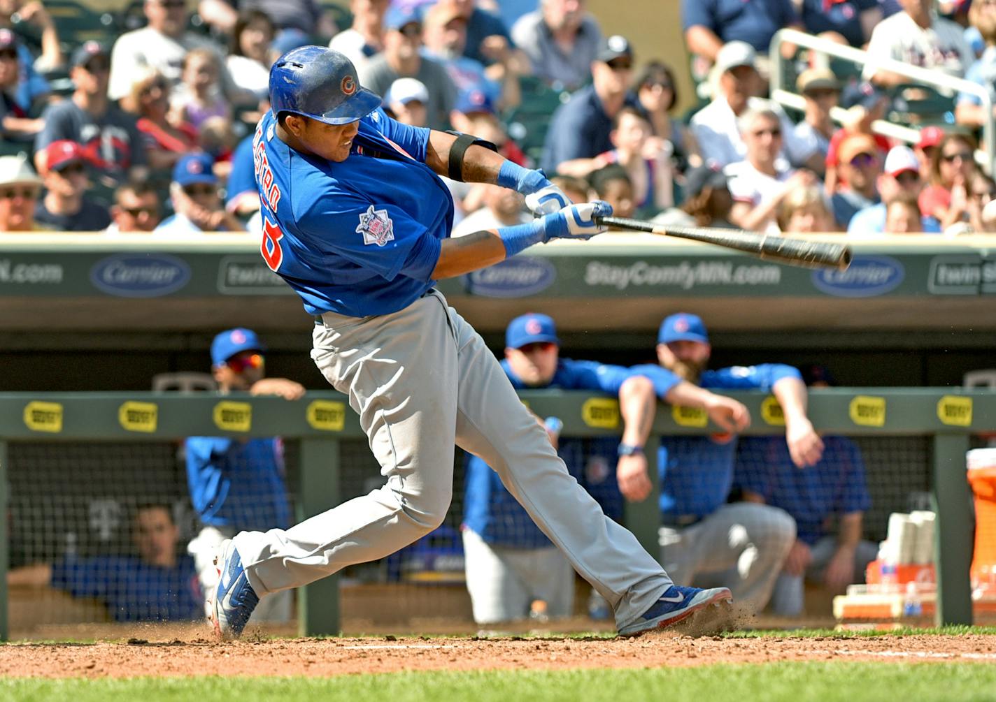 Chicago Cubs batter Starlin Castro follows through on a bases loaded single to knock in the go-ahead runs against the Minnesota Twins in the 10th inning of a baseball game, Saturday June 20, 2015, in Minneapolis. Chicago won 4-1 in 10 innings. (AP Photo/Richard Marshall)