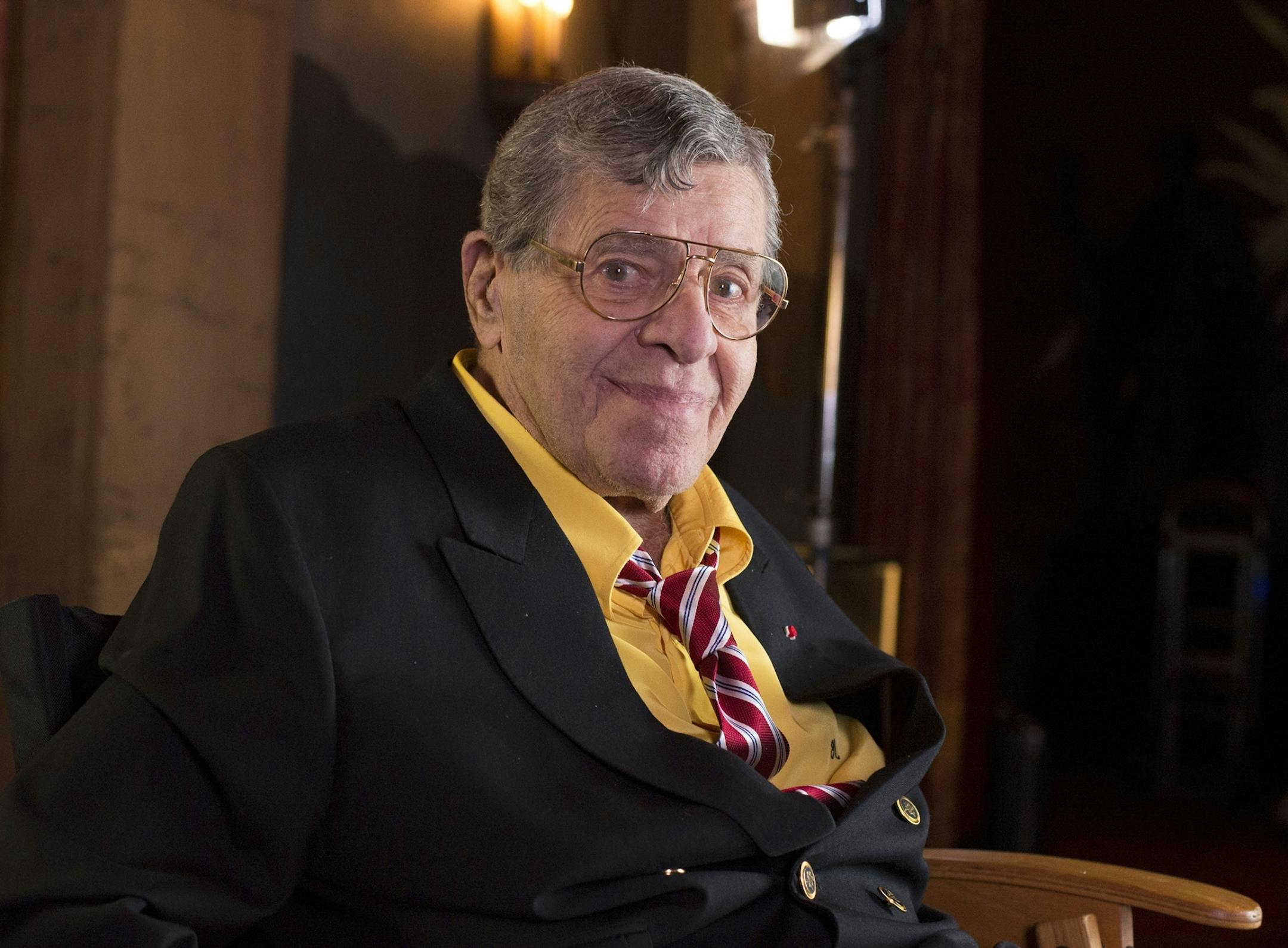 FILE - In this April 12, 2014 file photo, actor and comedian Jerry Lewis poses during an interview at TCL Chinese Theatre in Los Angeles. A publicist for Lewis says the comedian is recovering after being treated at a Las Vegas hospital for a urinary tract infection. The 91-year-old comedian was taken to the hospital on Friday, June 2, 2017, so that he could get antibiotics immediately to treat the condition. Publicist Candi Cazau says he is doing fine and is expected to be released shortly.