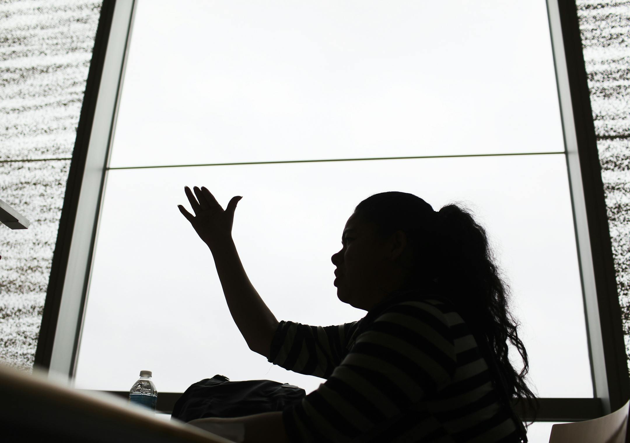 Dolores, an undocumented immigrant from Honduras, was locked up in the Sherburne County jail for two years, then suddenly released this week in an effort to for the federal government to save money in advance of looming federal budget cuts. Dolores was photographed at the downtown Minneapolis Public LibraryThursday, Feb. 28, 2013, in Minneapolis, MN.] (DAVID JOLES/STARTRIBUNE) djoles@startribune.com A woman from Honduras who was locked up in the Sherburne County jail for two years is among the h