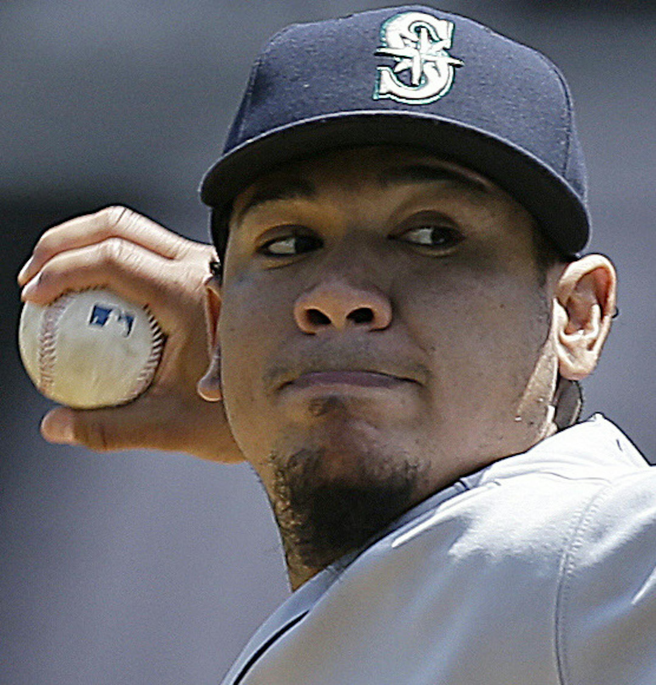 Seattle Mariners' Felix Hernandez works against the Oakland Athletics in the first inning of a baseball game Wednesday, May 7, 2014, in Oakland, Calif. (AP Photo/Ben Margot) ORG XMIT: OAS103