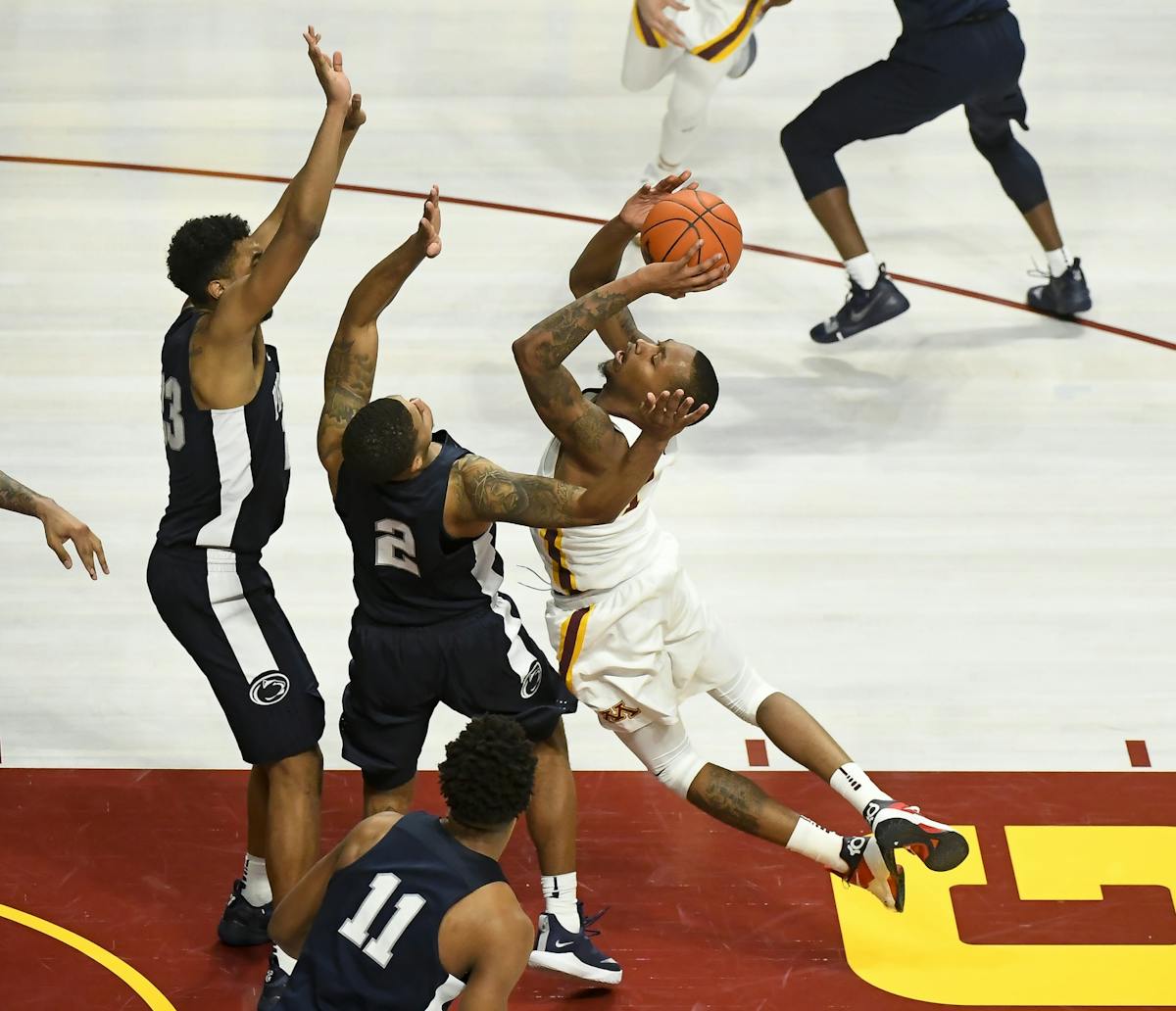 Minnesota Golden Gophers guard Dupree McBrayer (1) drew contact on a foul by Penn State Nittany Lions guard Myles Dread (2) with seconds left in the s
