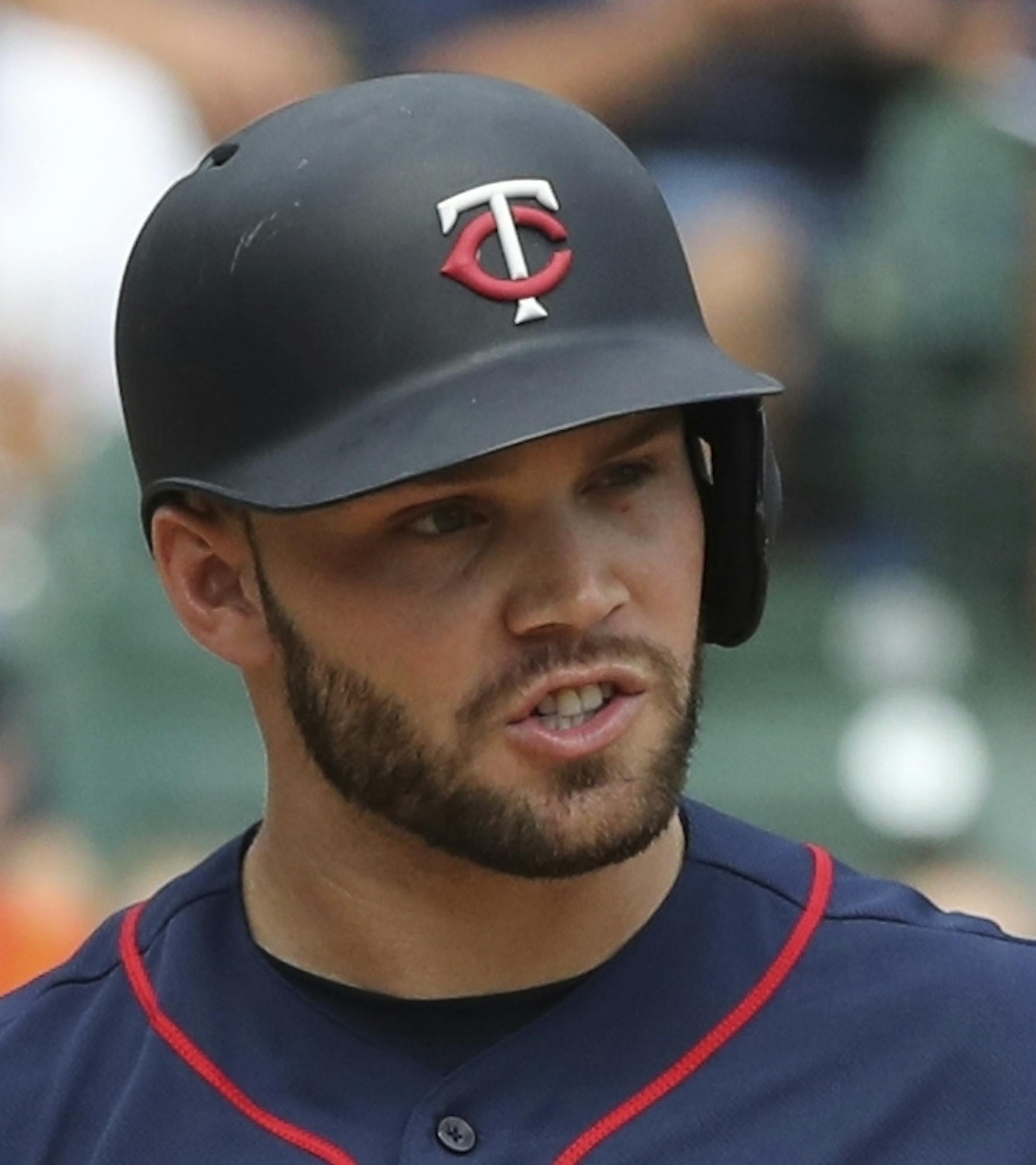 Minnesota Twins' Johnny Field walks to the dugout after striking out during the seventh inning of a baseball game against the Detroit Tigers, Sunday, Aug. 12, 2018, in Detroit. (AP Photo/Carlos Osorio)