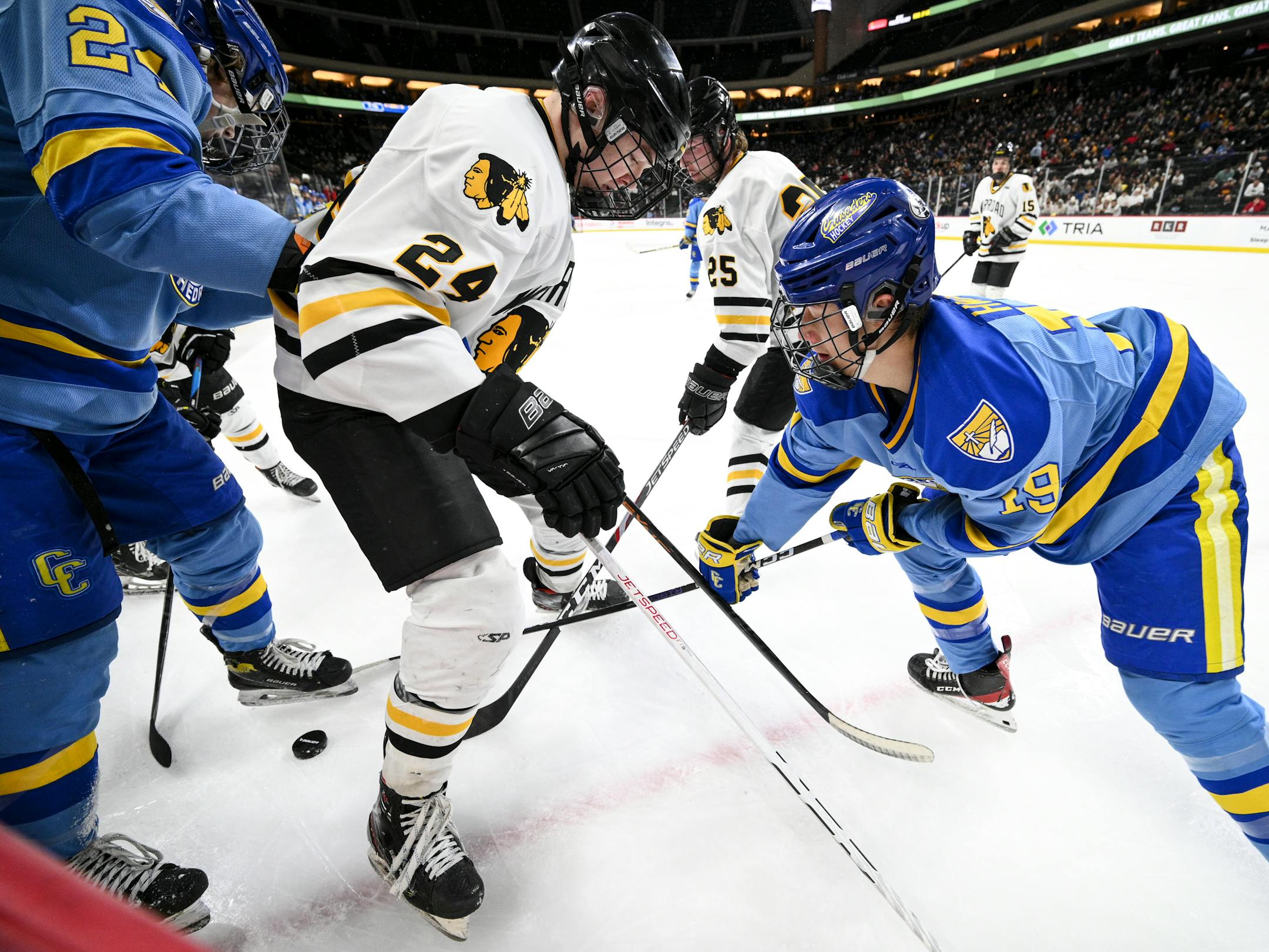 Warroad and St. Cloud Cathedral players battle for the puck during the second period of a Class 1A State Tournament boys hockey quarterfinal game Wednesday, March 8, 2023 at the Xcel Energy Center in St. Paul, Minn.