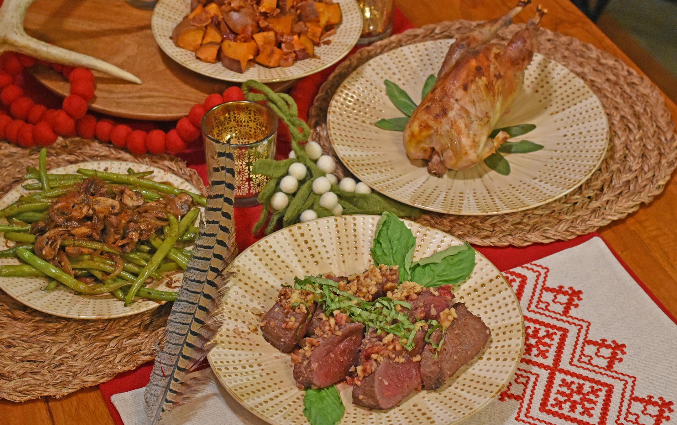 Bring a holiday-size appetite and feast on this holiday wild game dinner that includes walnut-crusted venison and mulled pheasant with green beans, as well as sweet potatoes with candied bacon.