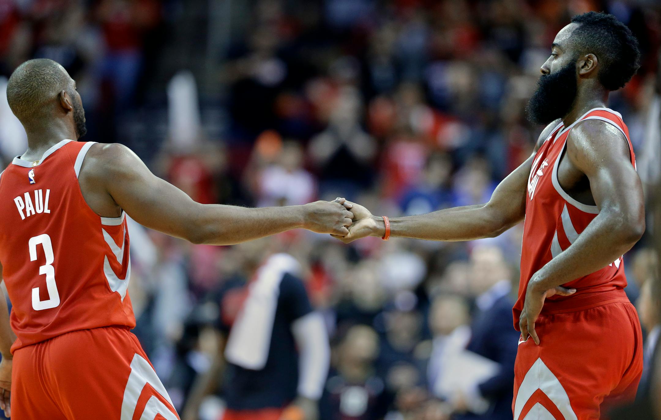 Houston Rockets guard Chris Paul (3) and guard James Harden (13)