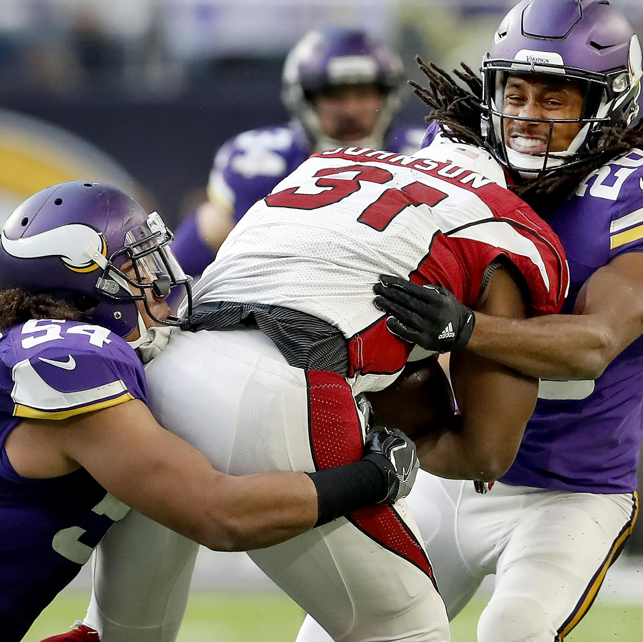 Eric Kendricks (54) and Trae Waynes (26) tackled David Johnson (31) in the third quarter. ] CARLOS GONZALEZ cgonzalez@startribune.com - November 20, 2016, Minneapolis, MN, US Bank Stadium, NFL, Minnesota Vikings vs. Arizona Cardinals