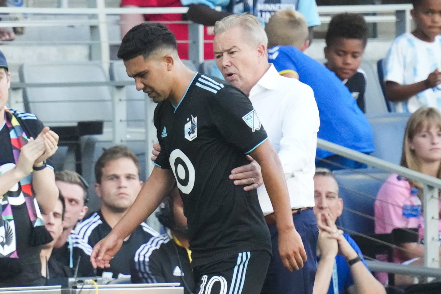 Loons head coach Adrian Heath spoke to All-Star Emanuel Reynoso during a game at Allianz Field on July 20, 2022.