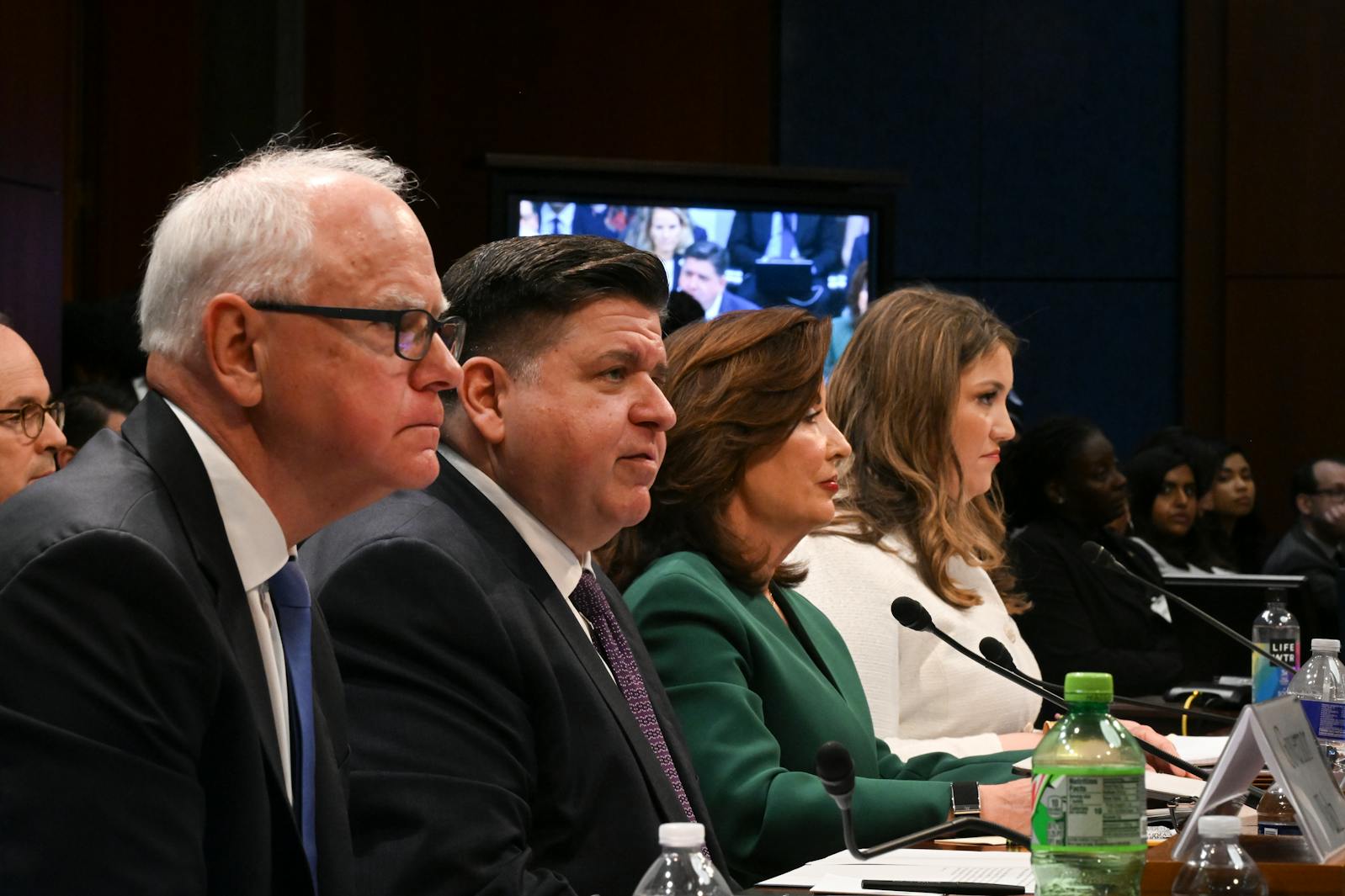 From left: Gov. Tim Walz of Minnesota, Gov. J.B. Pritzker of Illinois, Gov. Kathy Hochul of New York, and Skye Perryman, chief executive of the Democracy Forward Foundation, testify before the House Committee on Oversight and Government Reform during a hearing on state immigration policies on Capitol Hill in Washington on Thursday.