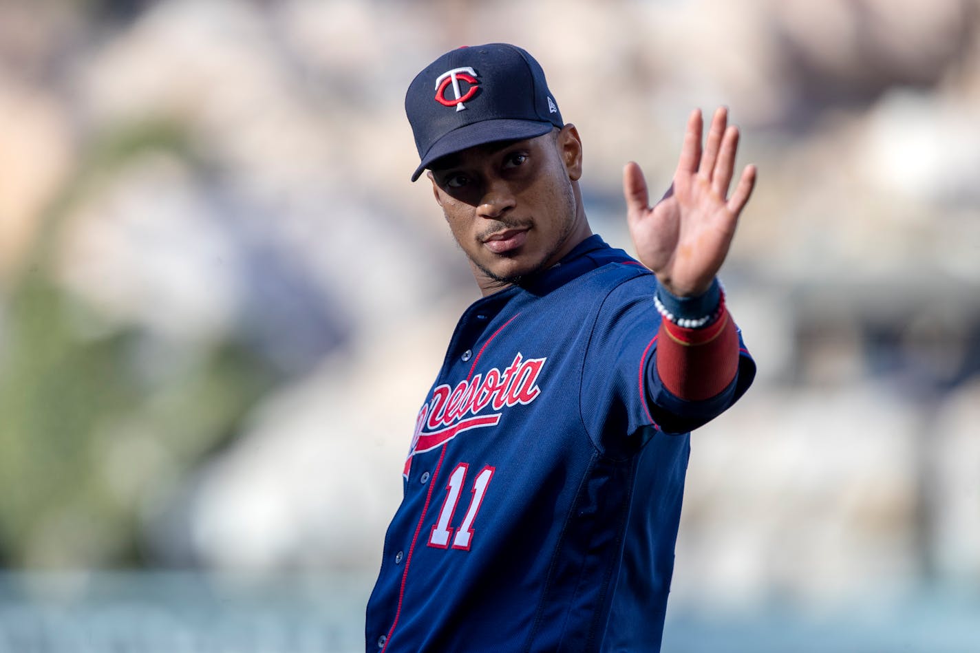 Minnesota Twins' Jorge Polanco waves to fans during warmups before a baseball game against the Los Angeles Angels in Anaheim, Calif., Saturday, Aug. 13, 2022. (AP Photo/Alex Gallardo)