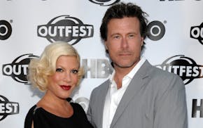 FILE - Tori Spelling, left, and Dean McDermott in 2011.