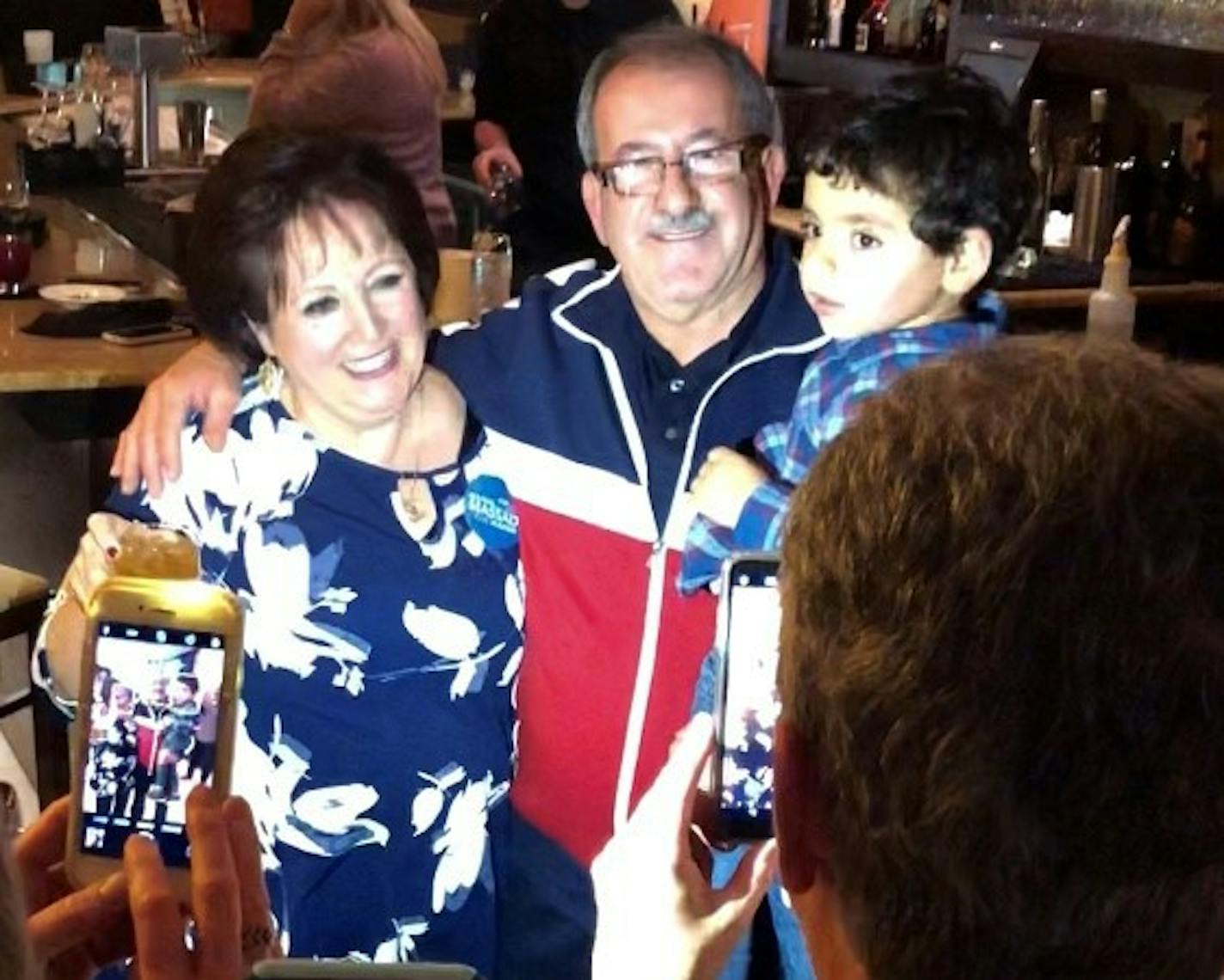 Mankato mayor-elect Najwa Massad, left, celebrates on election night with her husband, John, and grandson Johnnie.