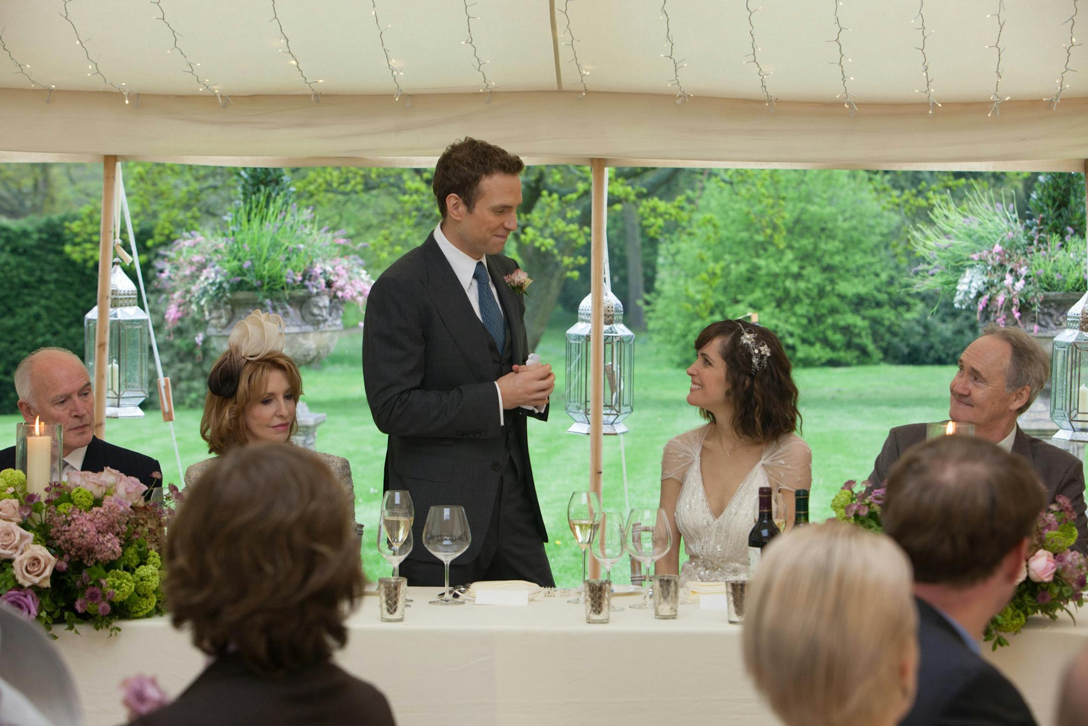 Josh (Rafe Spall) offers a wedding toast to his bride (Rose Byrne) in a scene from "I Give It a Year."