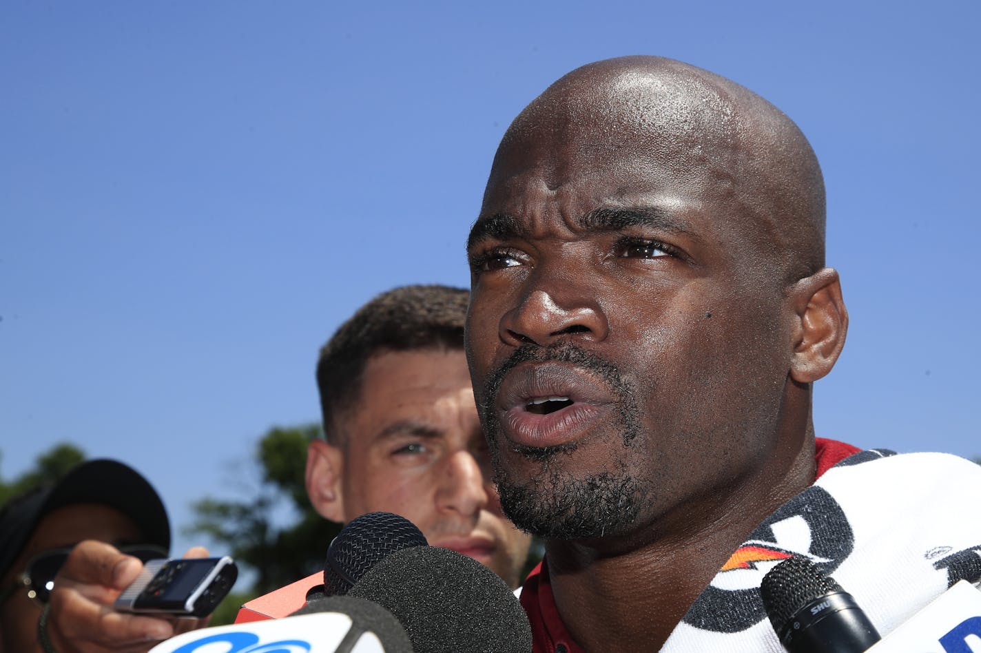 Adrian Peterson, the Vikings' career leading rusher, spoke to reporters in McLean, Va., at Redskins minicamp Tuesday. He was back in Minnesota conducting his first youth football camp in the state at Hopkins High School on Sunday.