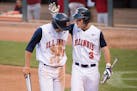 Illinois outfielder Casey Fletcher (3) patted Ryne Roper (15) on the helmet after Roper scored a run against Nebraska in the 6th inning. ] Aaron Lavin