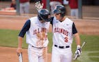 Illinois outfielder Casey Fletcher (3) patted Ryne Roper (15) on the helmet after Roper scored a run against Nebraska in the 6th inning. ] Aaron Lavin
