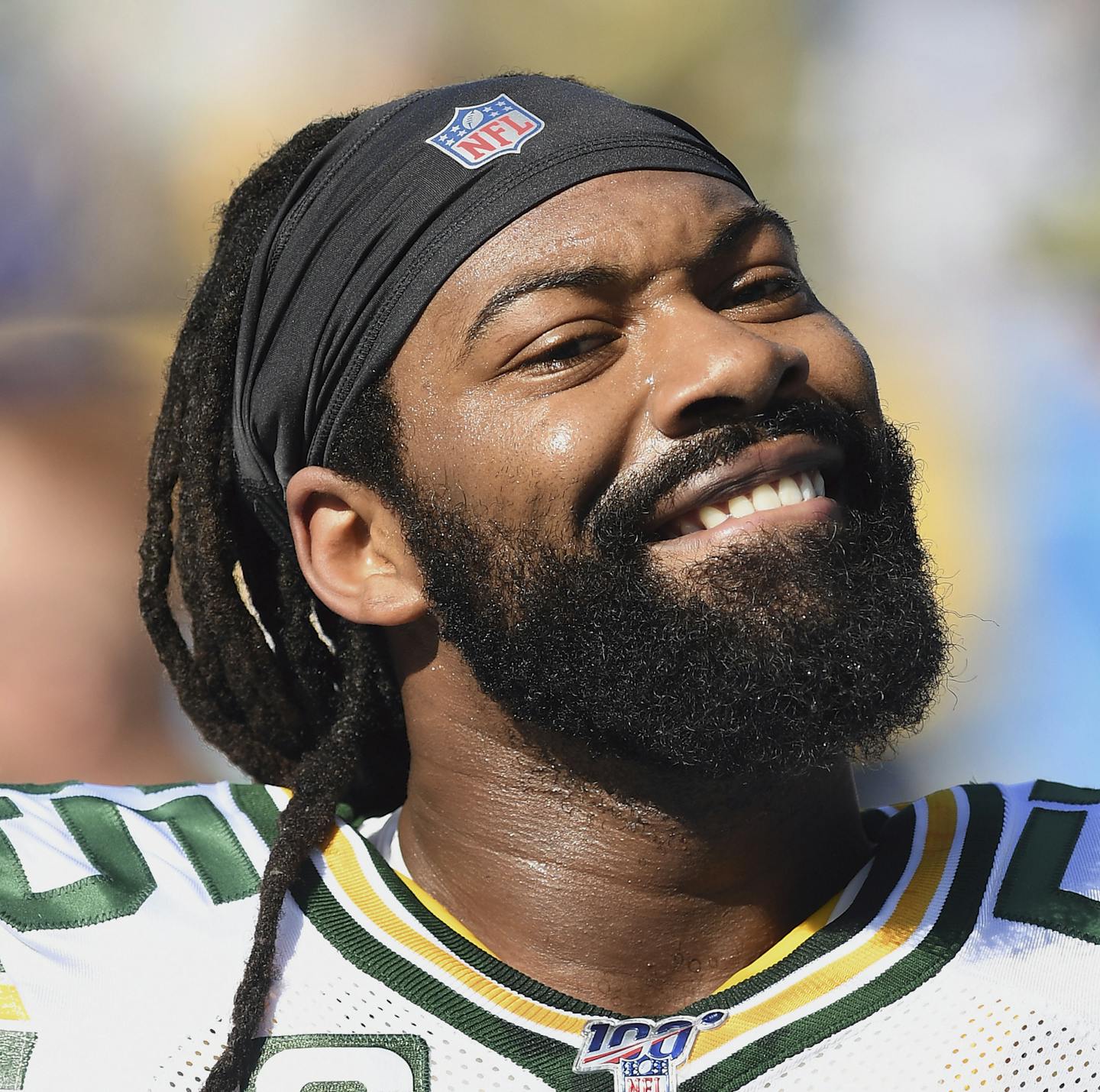 FILE - In this Sunday, Nov. 3, 2019, file photo, Green Bay Packers linebacker Za'Darius Smith (55) smiles towards the stands and a section of Packers fans before an NFL football game against the Los Angeles Chargers in Carson, Calif. Za'Darius Smith and Preston Smith aren't related, but the Packers pass rushers share the same last name and the same type of productive games. They combined for 25 ½ sacks last season after both signed with the Packers as free agents in early 2019. (AP Photo/John Co