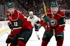 Minnesota Wild Eric Staal (12) and Charlie Coyle (3).