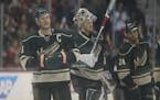 Wild captain Mikko Koivu (9) stood at center ice as he and his teammates saluted the Xcel Energy Center fans after the game Sunday.