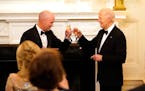 Utah Gov. Spencer Cox, left, and President Joe Biden toast before Biden speaks to members of the National Governors Association during an event in the