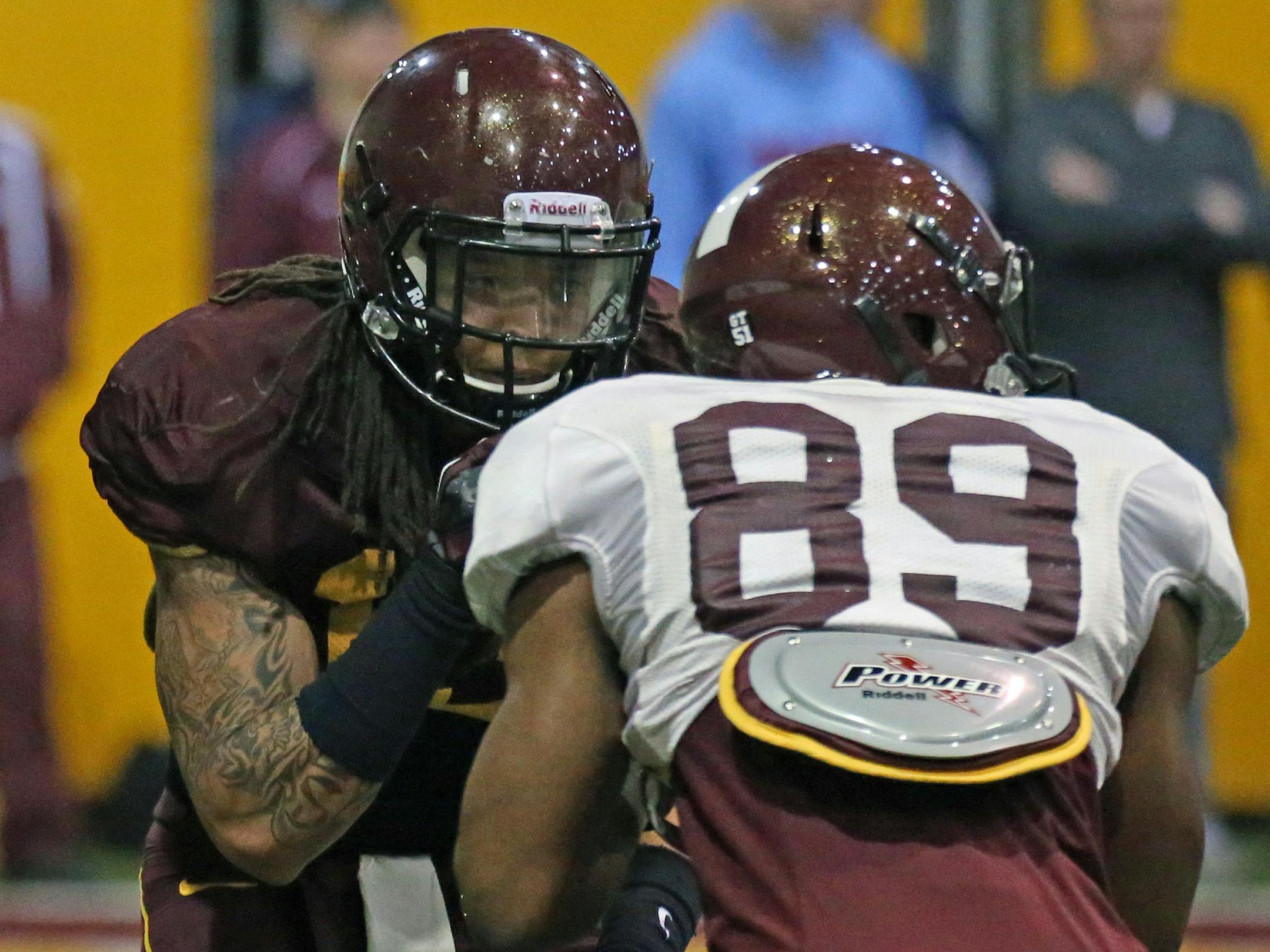 Cornerback Derrick Well, left, lined up against wide receiver Logan Hutton in practice.