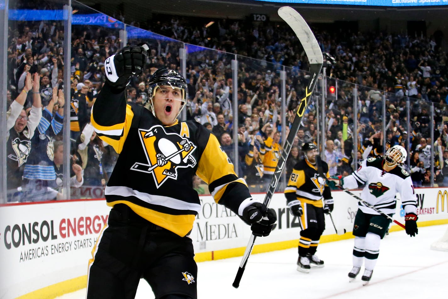 The Penguins' Evgeni Malkin celebrated his goal in the second period of a 4-3 victory over the Wild in Pittsburgh on Tuesday. Malkin had a hand in all four PIttsburgh goals.