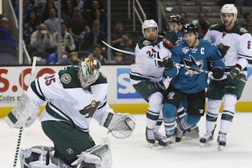 Minnesota Wild goalie Darcy Kuemper finds the puck behind him after a shot by the San Jose Sharks in the first period at SAP Arena in San Jose, Calif.