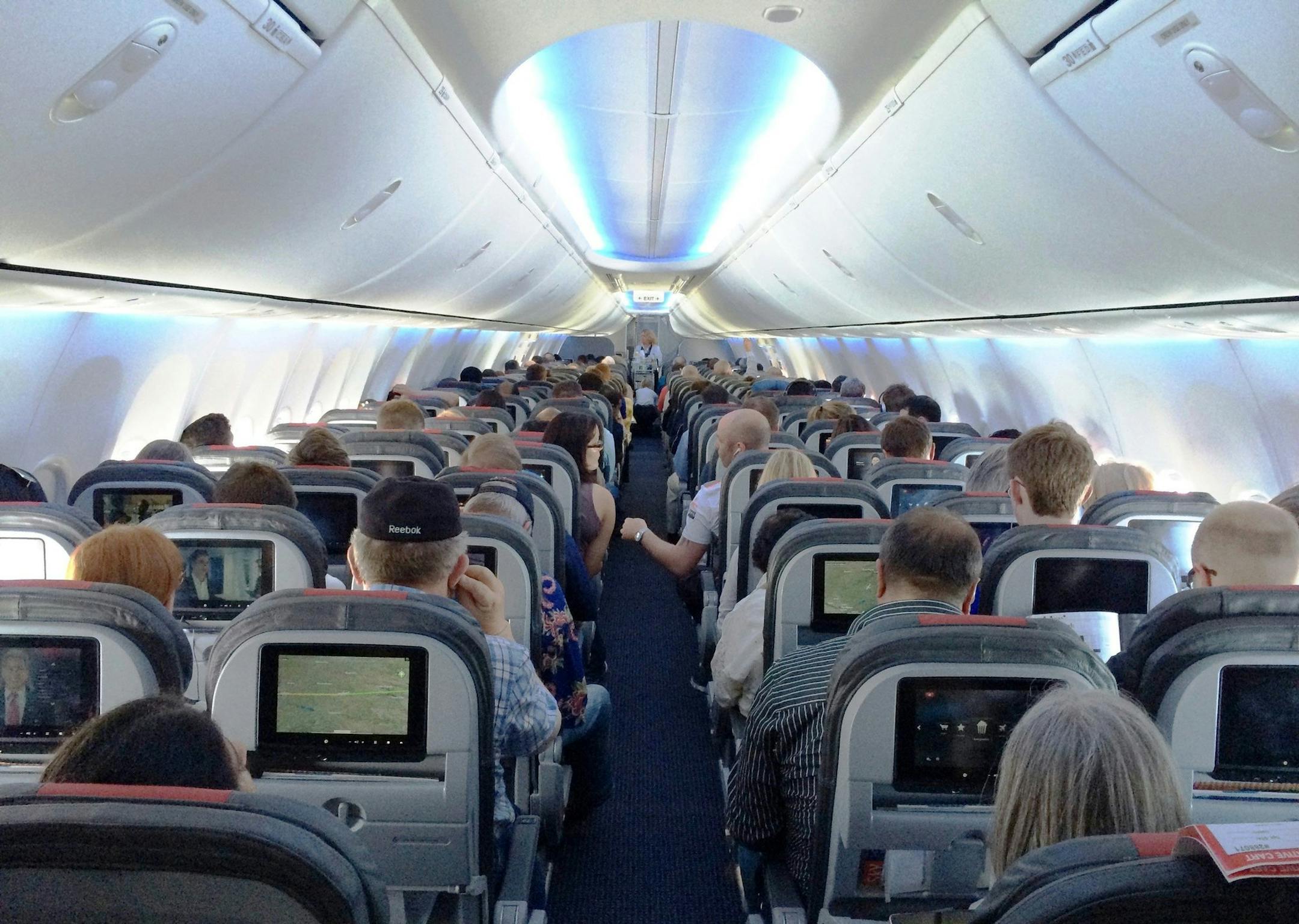 One of American Airlines' new 737s. The cabin gives standard economy passengers less space, but also an entertainment system to distract them. (Josh Noel/Chicago Tribune/MCT) ORG XMIT: 1154887