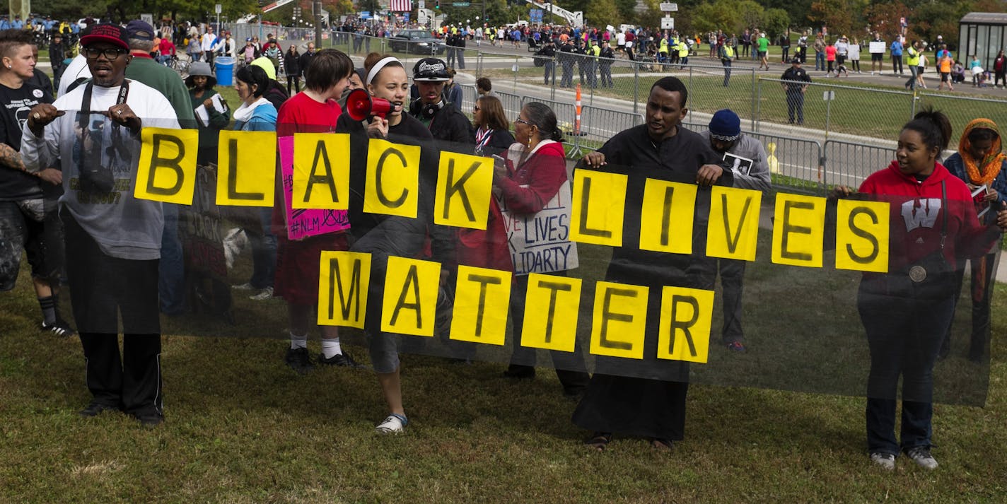 Protesters marched back to Boyd Park after rallying near the marathon finish line. ] Mark Vancleave - mark.vancleave@startribune.com * About 60 protesters marched from Boyd Park on to the Twin Cities Marathon course for #BlackMarathon, organized by Black Lives Matter St. Paul, on Sunday, Oct. 4, 2015.