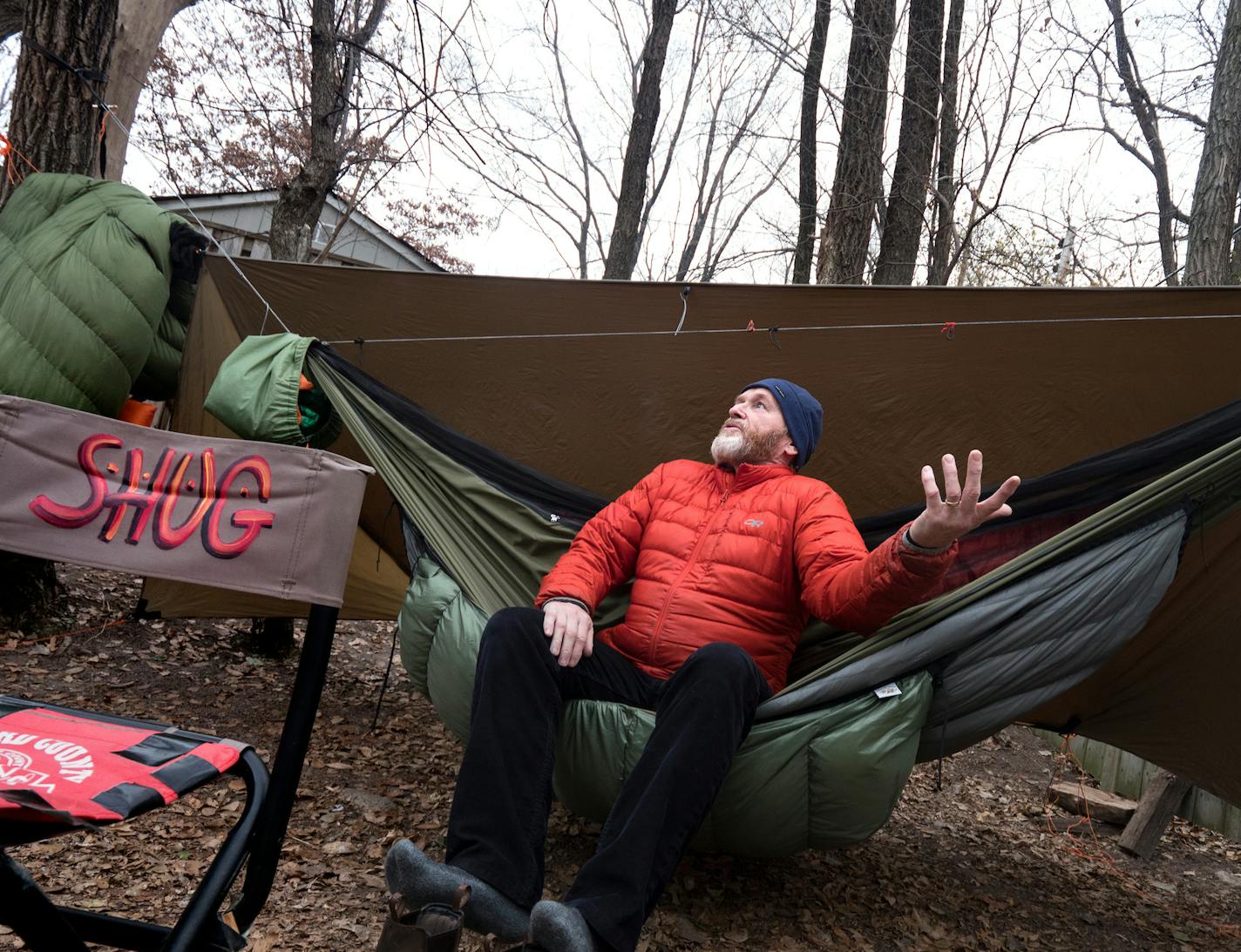 Sean Emery describes his process of making videos in his backyard "studio" which consists of a hammock, tarp and small table with camp cooking gear in St. Paul November 27, 2018. (Courtney Perry)