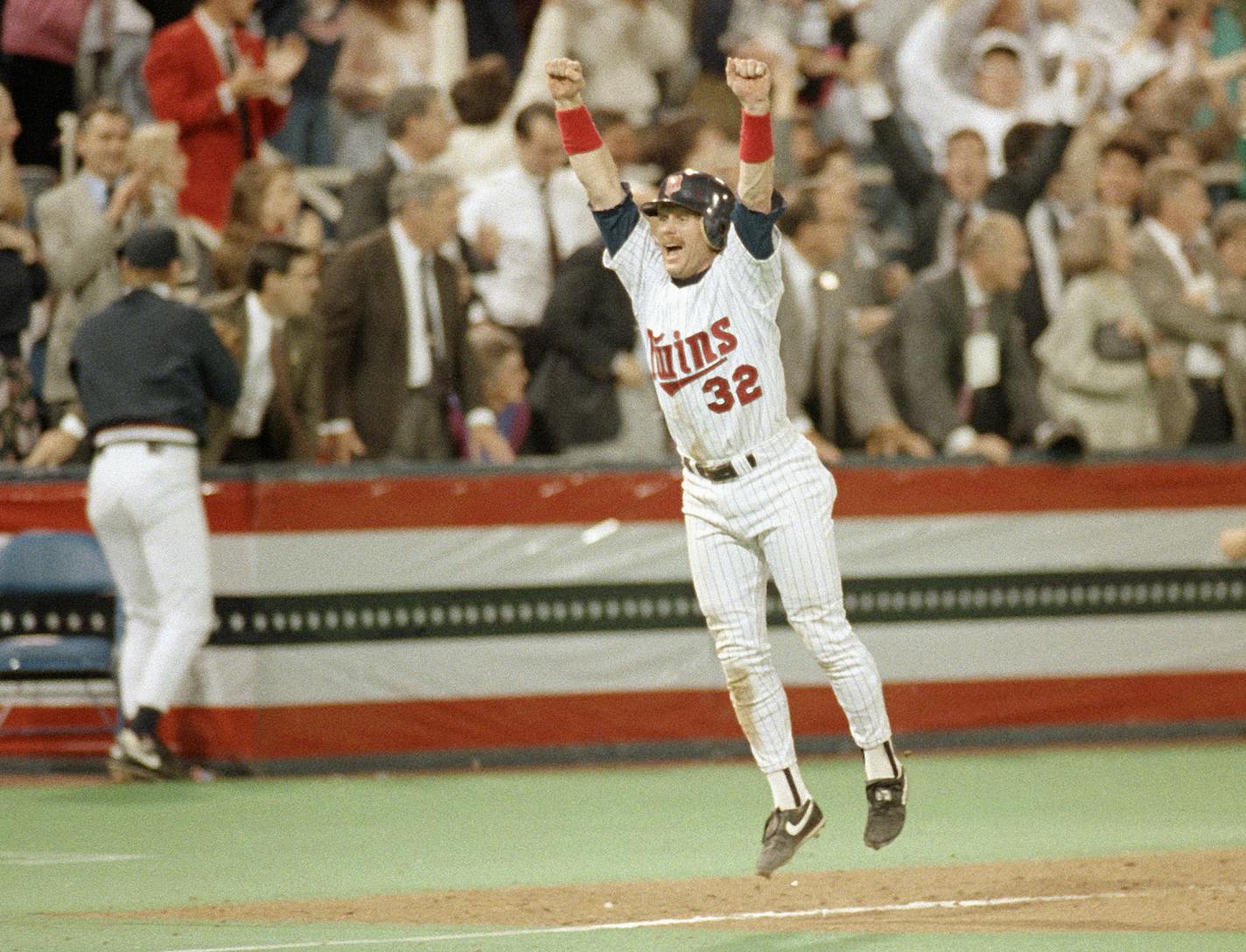 Minnesota Twins Dan Gladden celebrates as he heads home on teammate's Gen Larkin's single in the tenth inning of game 7 to win the World Series in Minneapolis, Oct. 27, 1991. (AP Photo/Mark Duncan) ORG XMIT: APHS78902