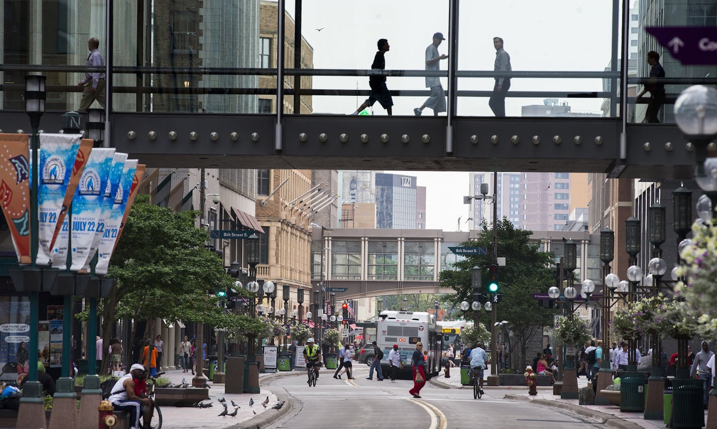 Traffic on Nicollet Mall in downtown Minneapolis seen on Monday, June 29, 2015. ] LEILA NAVIDI leila.navidi@startribune.com / BACKGROUND INFORMATION: Shortly after the Independence Day holiday weekend, crews will close the mall to motor vehicle traffic so they can continue upgrading and relocating the lines for power, gas, telecommunications, sanitary sewer and water beneath the street in advance of the complete mall reconstruction in 2016 and 2017.