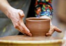 Art teacher Rachel Hoemke works on throwing a bowl for the Empty Bowls fundraiser at Edison High School Thursday, April 13, 2017, in Minneapolis, MN.