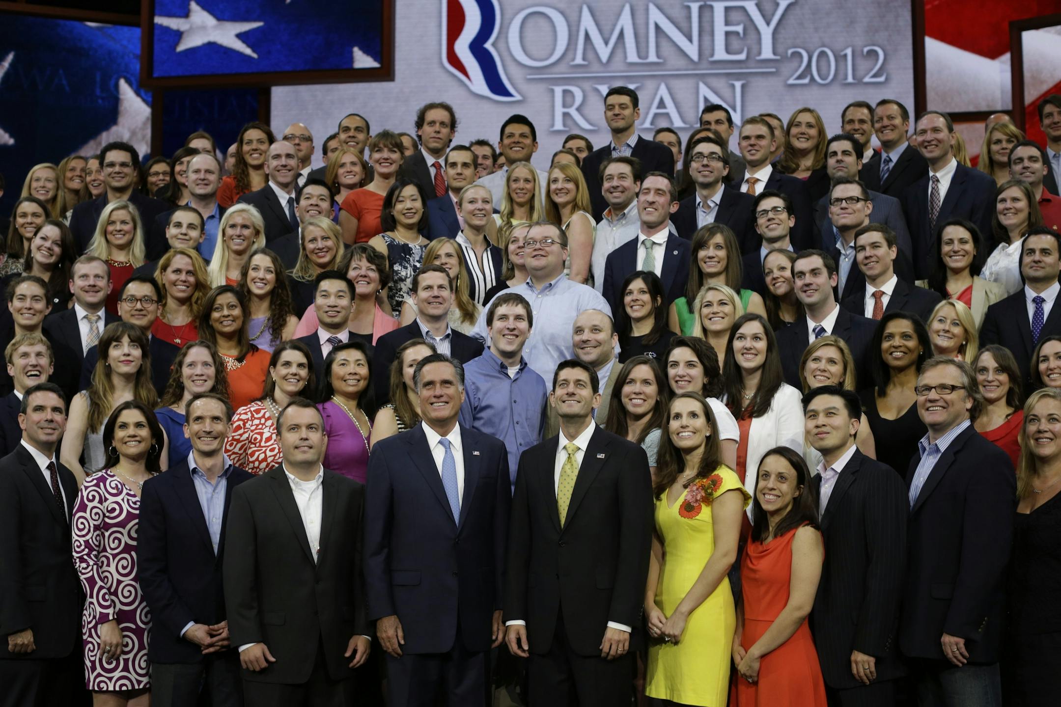 Republican presidential nominee Mitt Romney and Republican vice presidential nominee, Rep. Paul Ryan pose with their campaign staff for a group picture at the Republican National Convention in Tampa, Fla., on Thursday, Aug. 30, 2012.