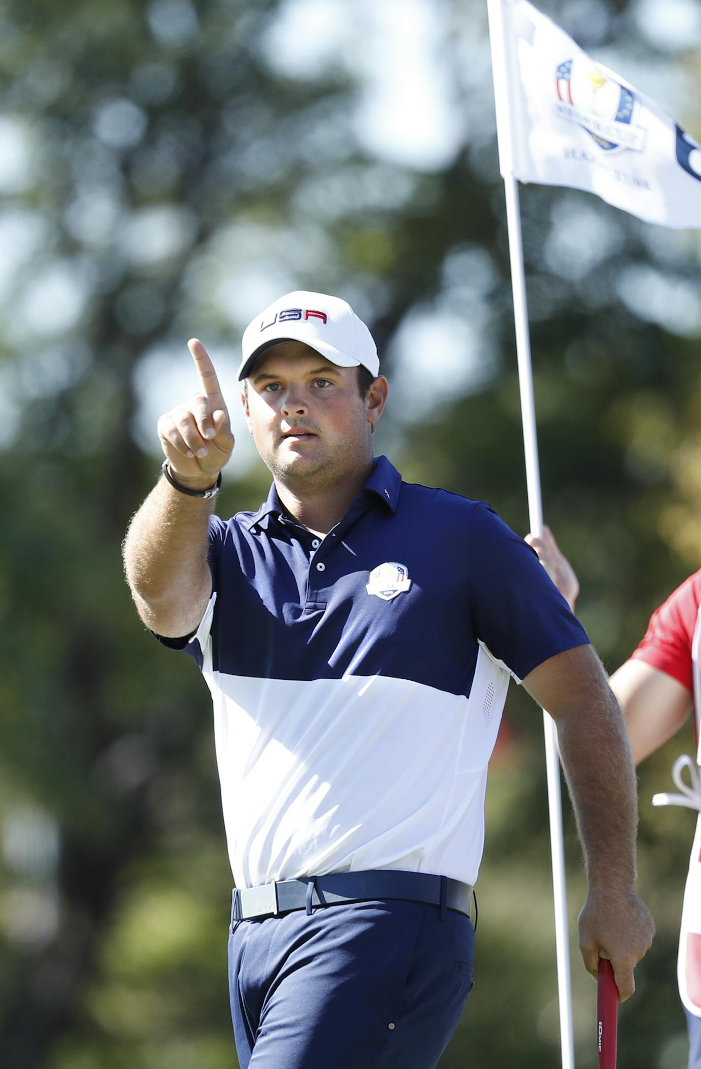 USA golfer, Patrick Reed reacts with a finger wave after making a putt 5th to go all-square with european, Rory McIlroy, Sunday morning in a match. ] JERRY HOLT jerry. Holt@Startribune.com The Ryder Cup match play Sunday October 2, 2016 at Hazeltine National Golf Club in Chaska, Minn.