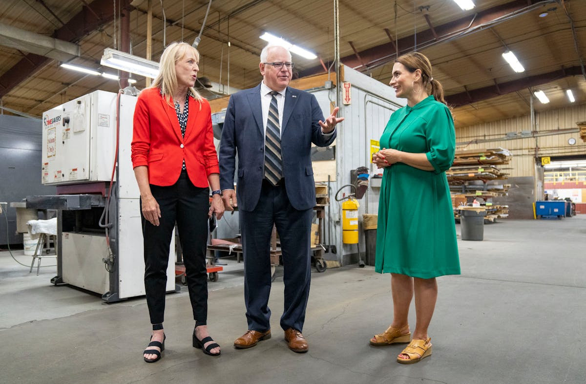 Traci Tapani, left, co-owner of Wyoming Machine and a member of the governor’s Council on Economic Expansion, spoke with Gov. Tim Walz and Lt. Gov. 
