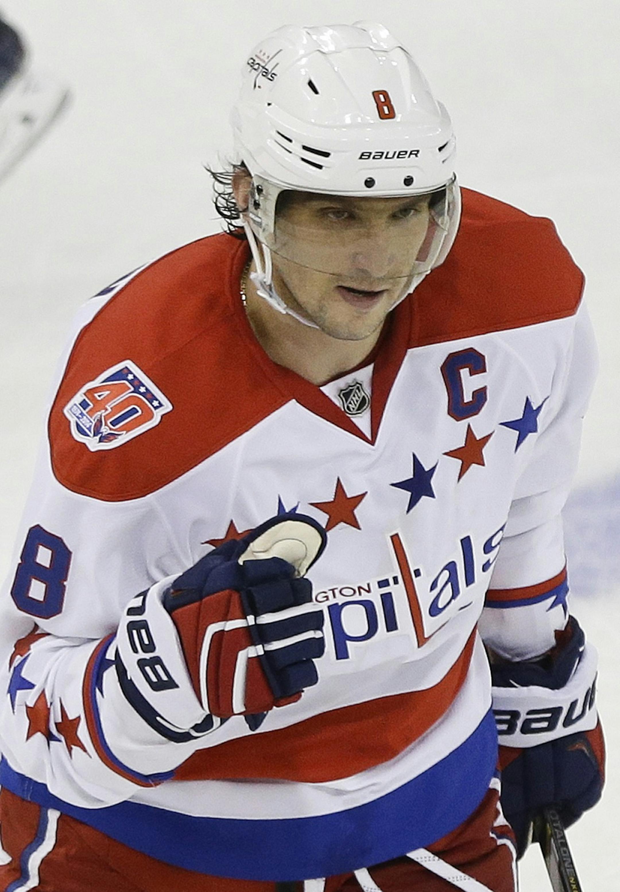 Washington Capitals left wing Alex Ovechkin (8), of Russia, celebrates after scoring a goal during the third period of an NHL hockey game against the New York Rangers, Tuesday, Dec. 23, 2014, in New York. The Rangers won the game 4-2. (AP Photo/Frank Franklin II) ORG XMIT: MSG111
