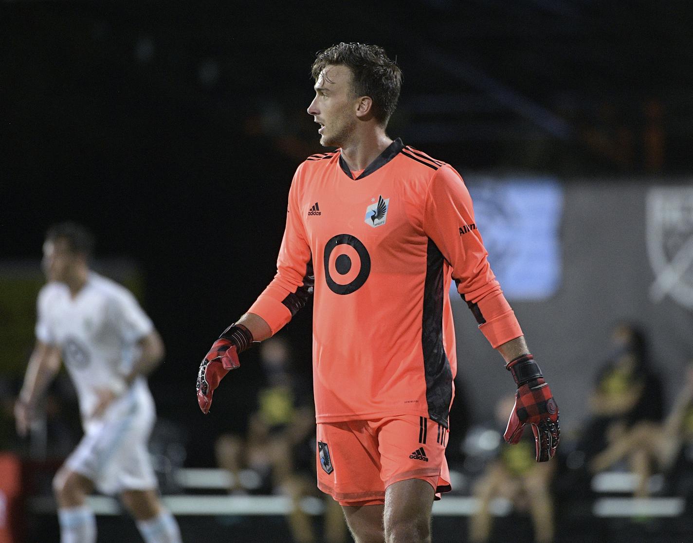 Minnesota United goalkeeper Tyler Miller (1) sets up for a play during the second half of an MLS soccer match against Sporting Kansas City, Sunday, July 12, 2020, in Kissimmee, Fla. (AP Photo/Phelan M. Ebenhack)