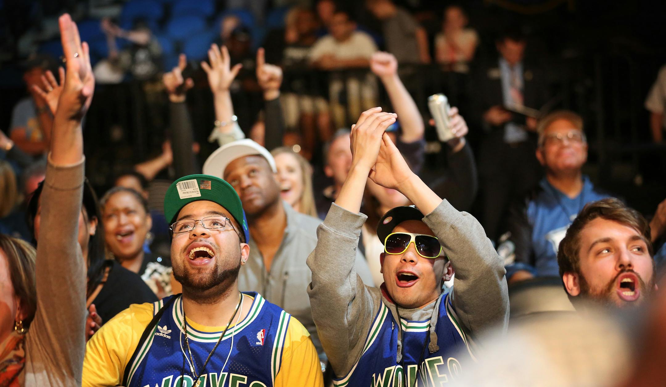 Timberwolves fans Dan Robbins left and Brandon Bazile cheered after Minnesota received the first pick in the NBA draft.