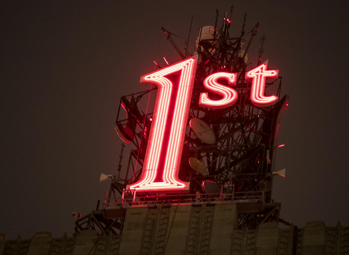 The iconic red "1st" sign in downtown St. Paul, which has been dark for 10 months, was re-lit on Tuesday, November 22, 2016, in St. Paul, Minn. ] RENEE JONES SCHNEIDER &#x2022; renee.jones@startribune.com The iconic red "1st" sign in downtown St. Paul, which has been dark for 10 months, will be relit Tuesday evening. First National Bank Building owners replaced the sign's neon lights with LED lighting, part of a $12 million energy efficiency overhaul at the building.